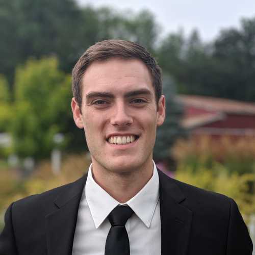 headshot of Isaac Schwab wearing a suit